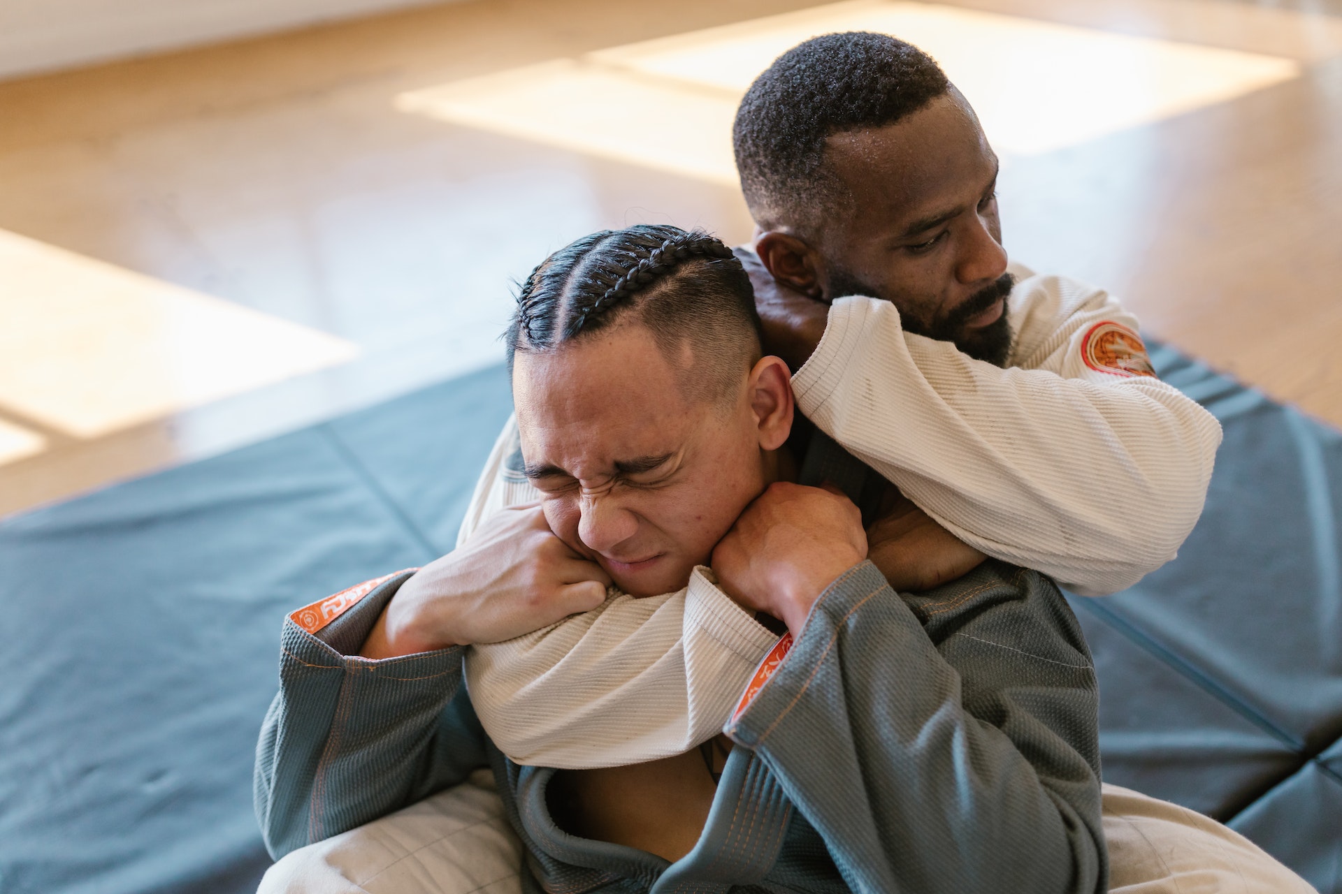 Sensei performing choke technique on student